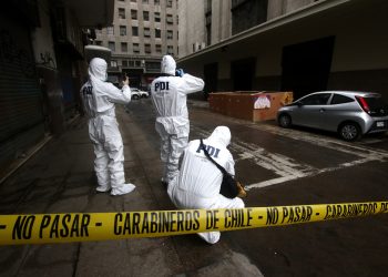 Homicidio que terminó con hombre quemado en Santiago se debería a una discusión de pareja