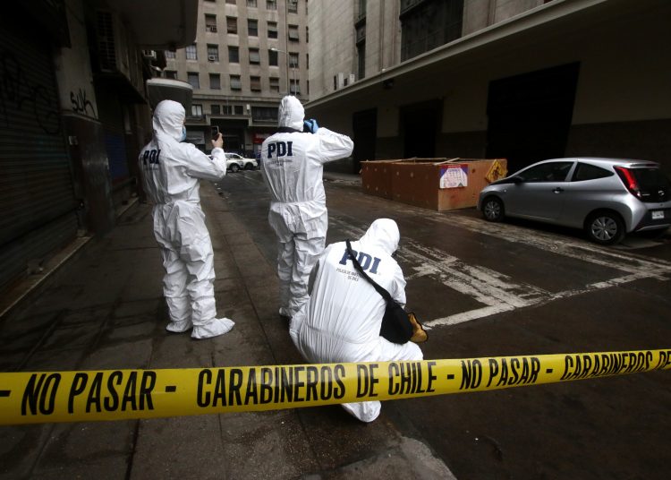 Homicidio que terminó con hombre quemado en Santiago se debería a una discusión de pareja